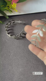 Load and play video in Gallery viewer, Ekani Jasmine Trendy Silver-toned Fern Leaf Metallic Hoop Earrings
